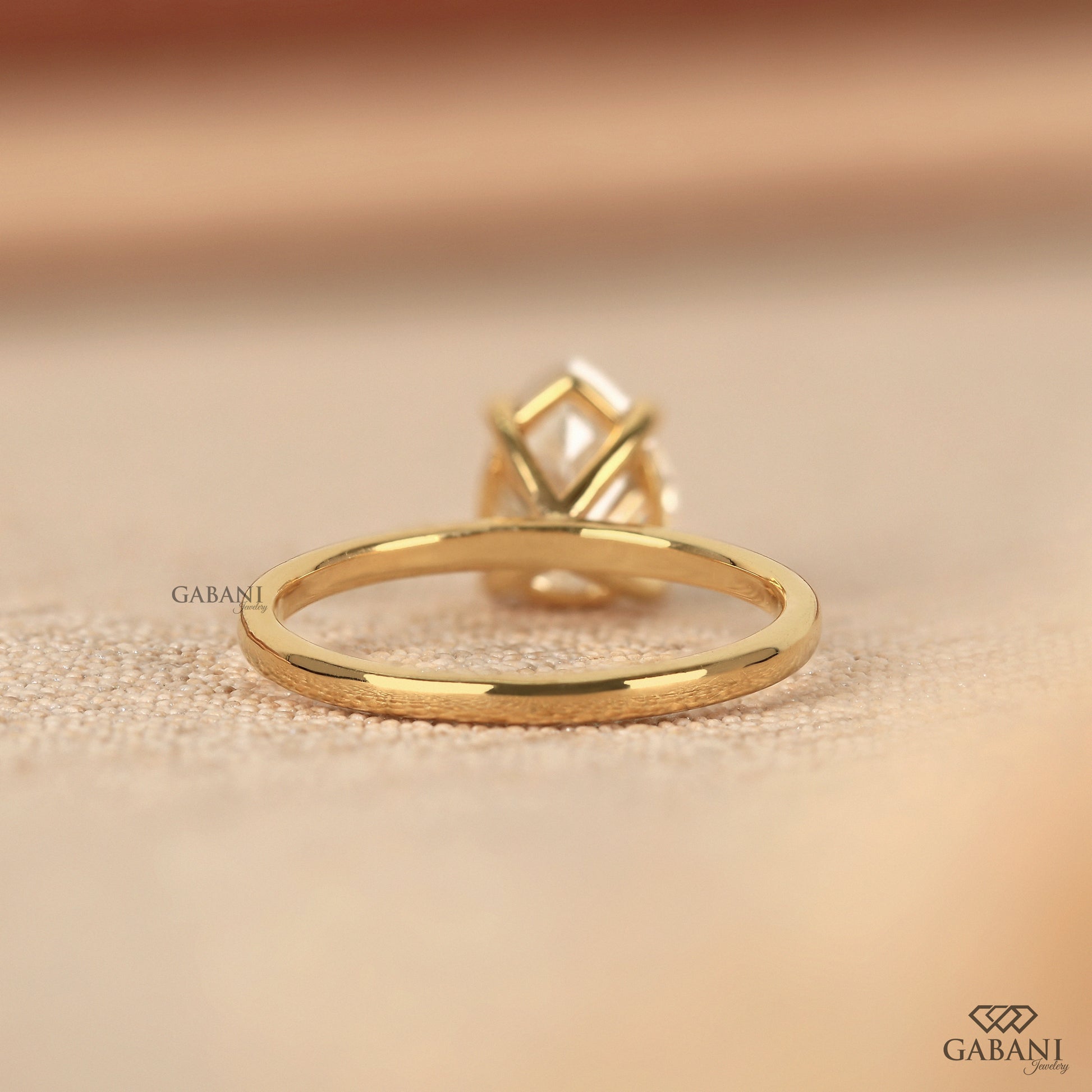 pear cut lab grown diamond solitaire engagement style ring in yellow gold
