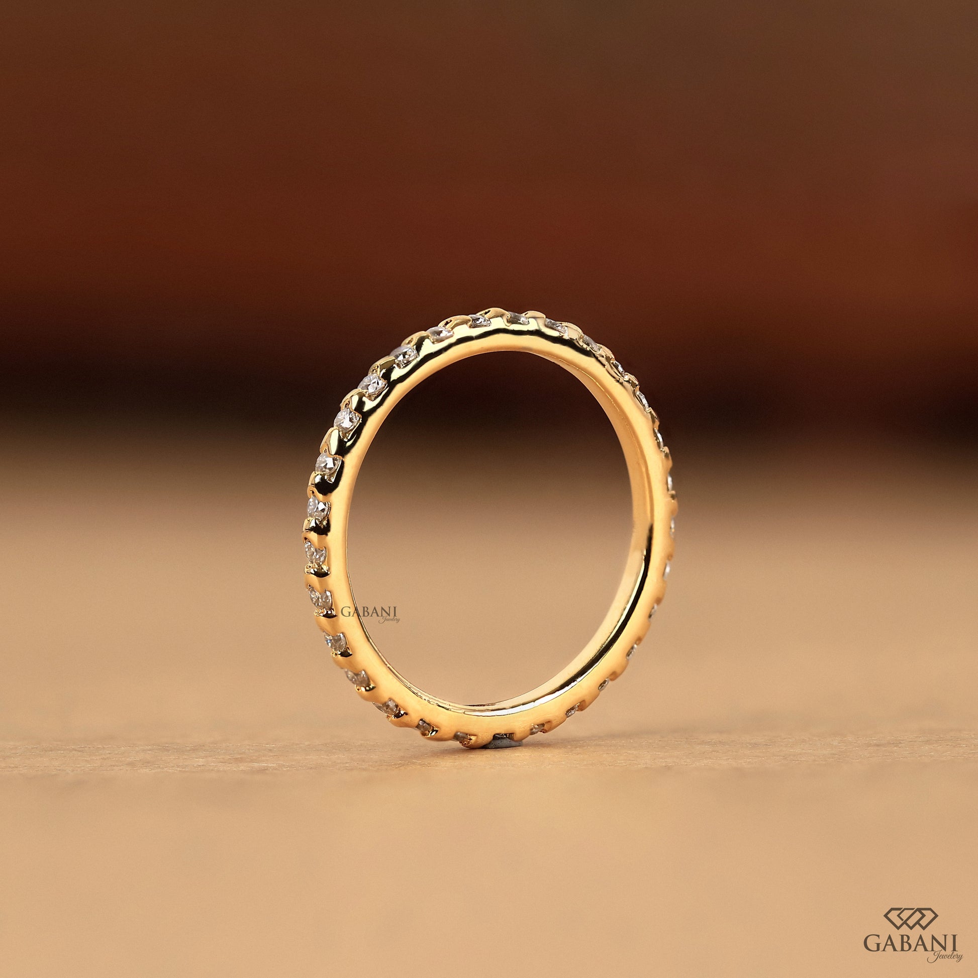 thin stacking diamond band with round lab diamonds set in bar style yellow gold ring