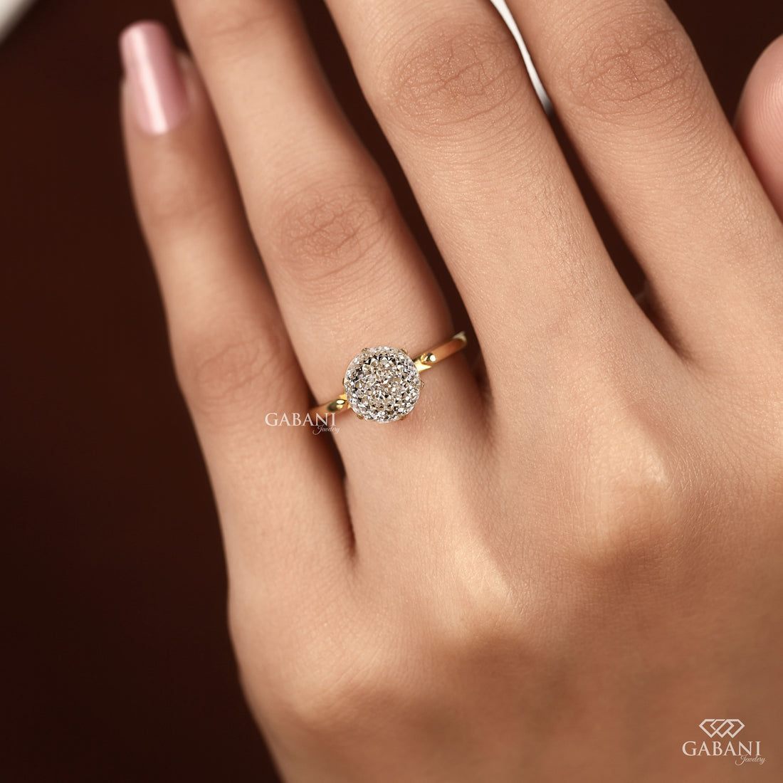 Round Portuguese cut lab grown diamond solitaire engagement ring in yellow gold with a six-prong tulip basket and polished plain band.
