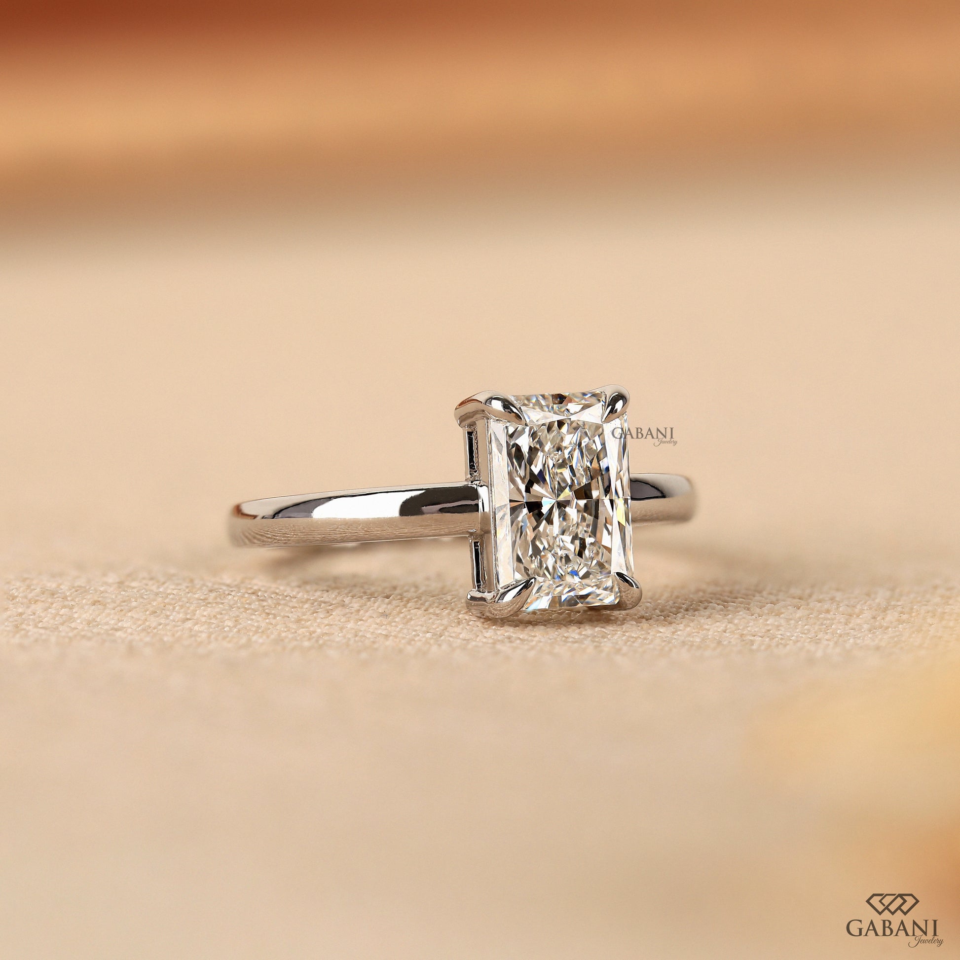radiant diamond solitaire ring in 14k white gold with clean modern profile