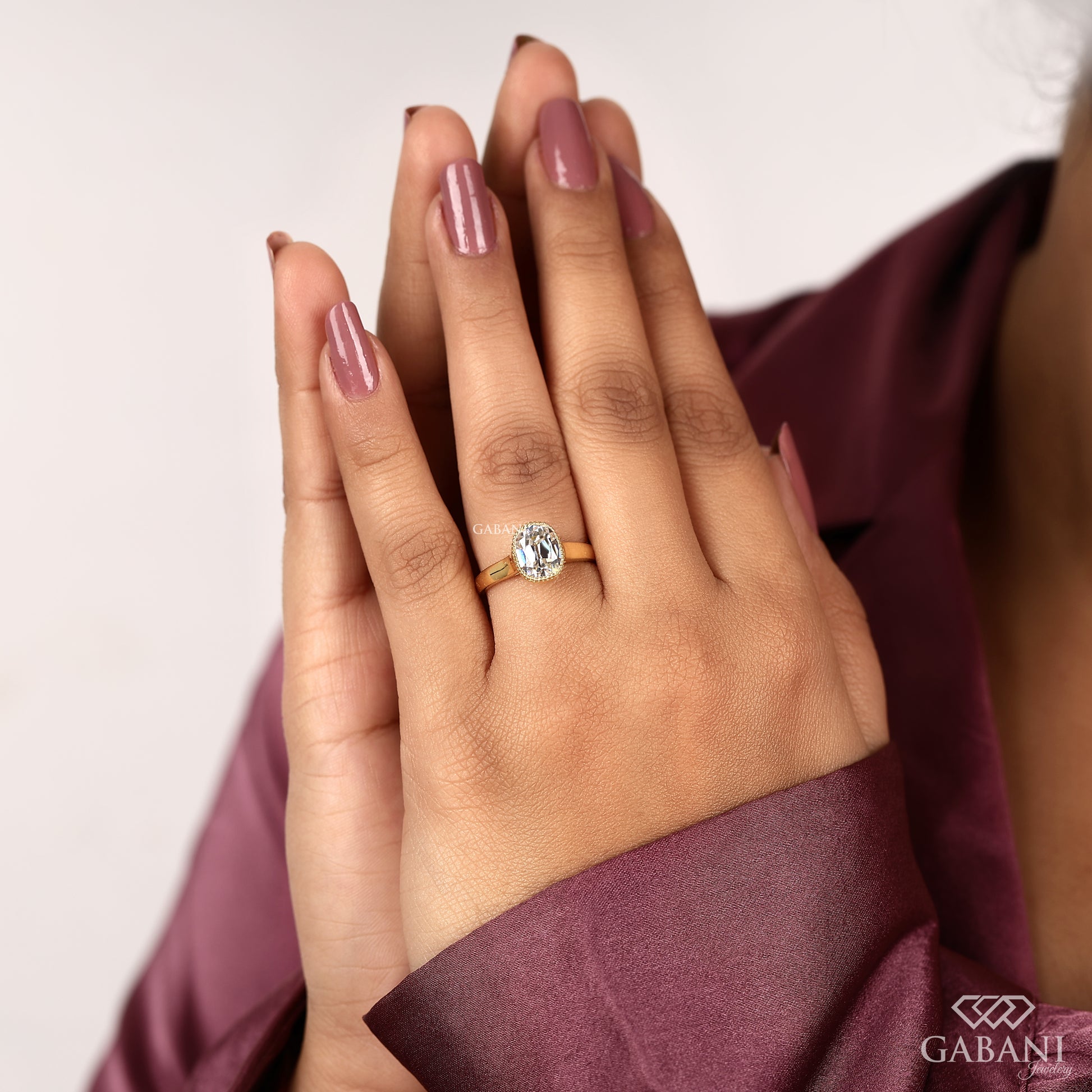 Old mine cut cushion lab grown diamond engagement ring in a classic bezel solitaire style