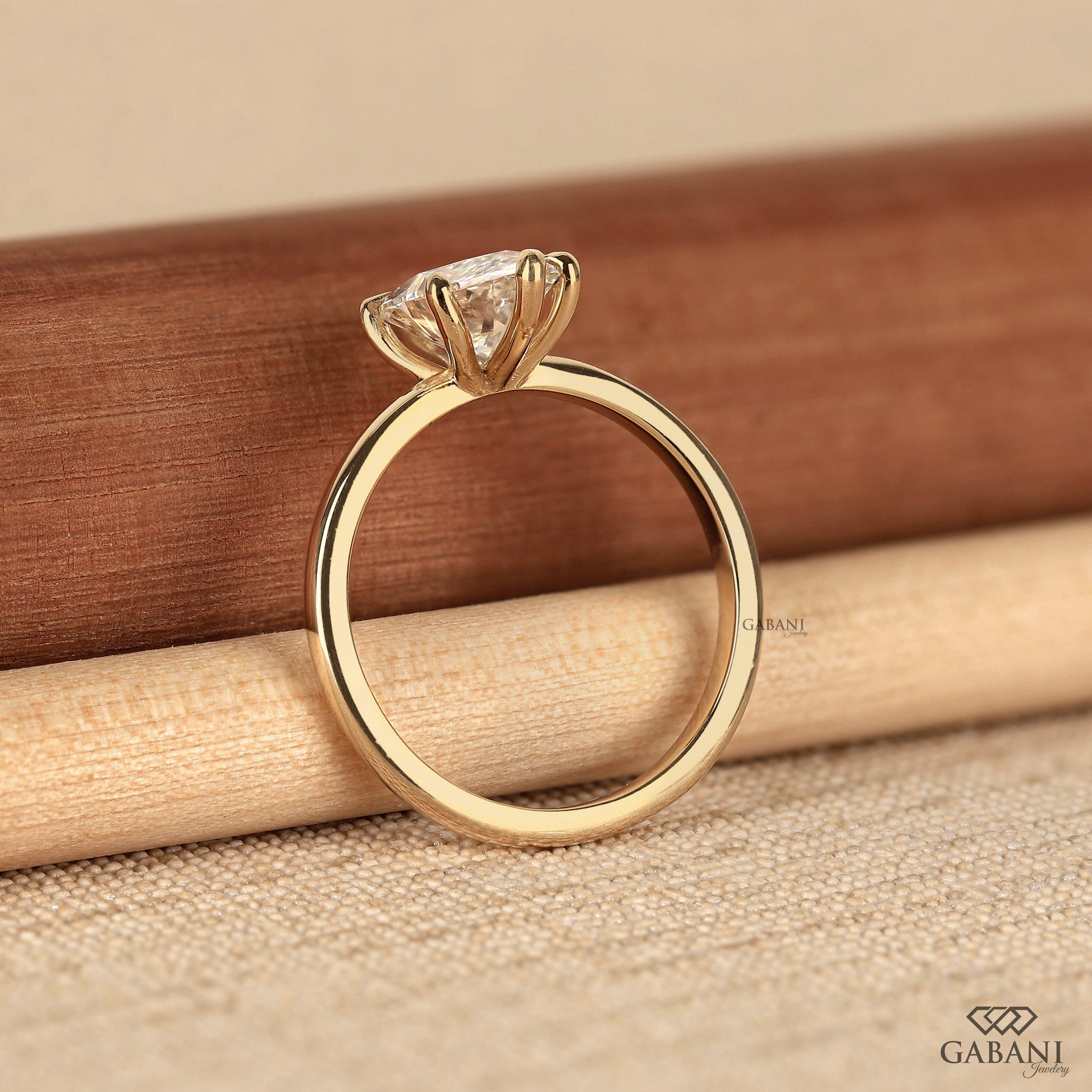 Timeless marquise solitaire ring with smooth polished band
