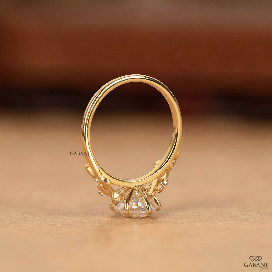 Standing view of nature inspired pear cut lab grown diamond engagement ring