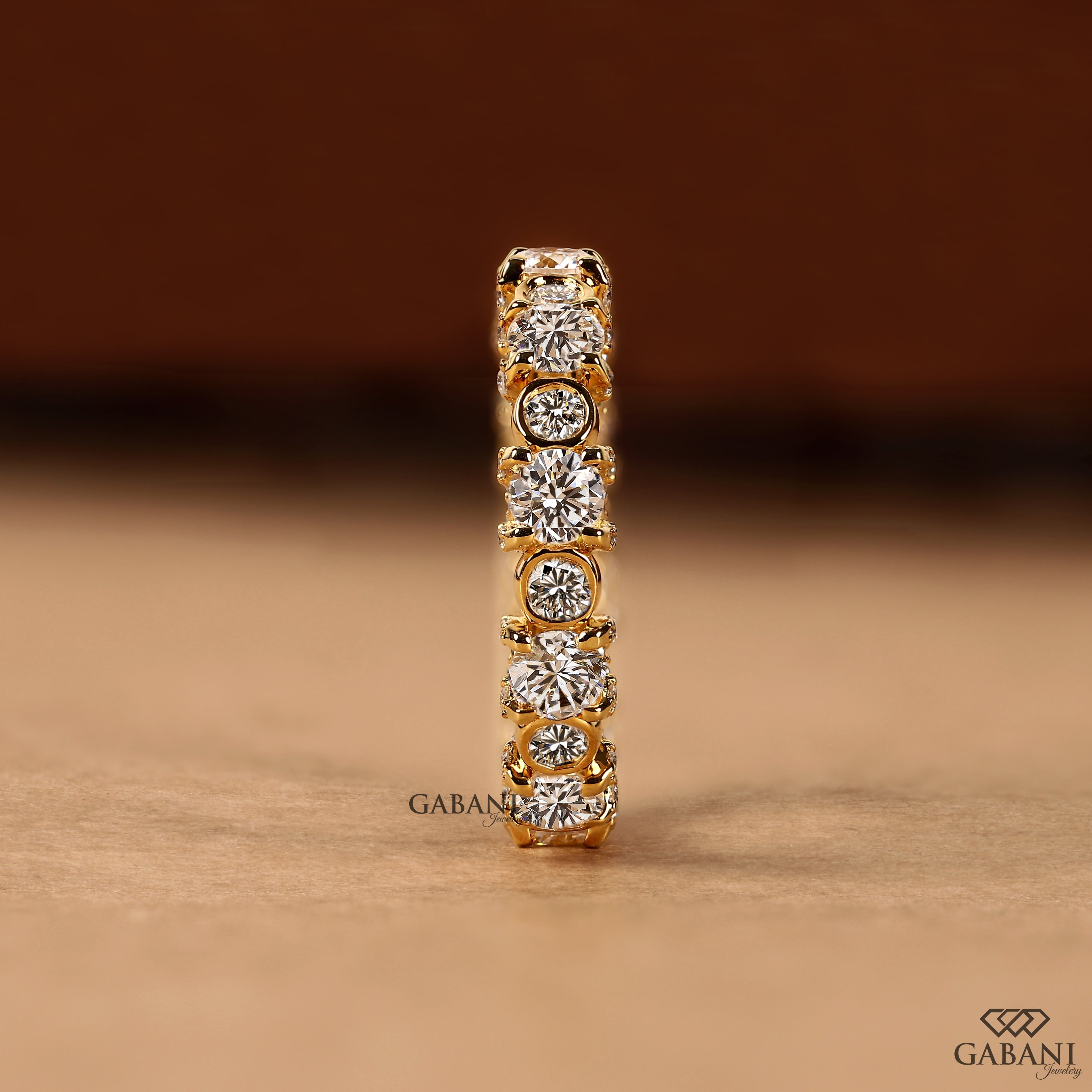 Chunky diamond ring featuring round cut lab grown stones
