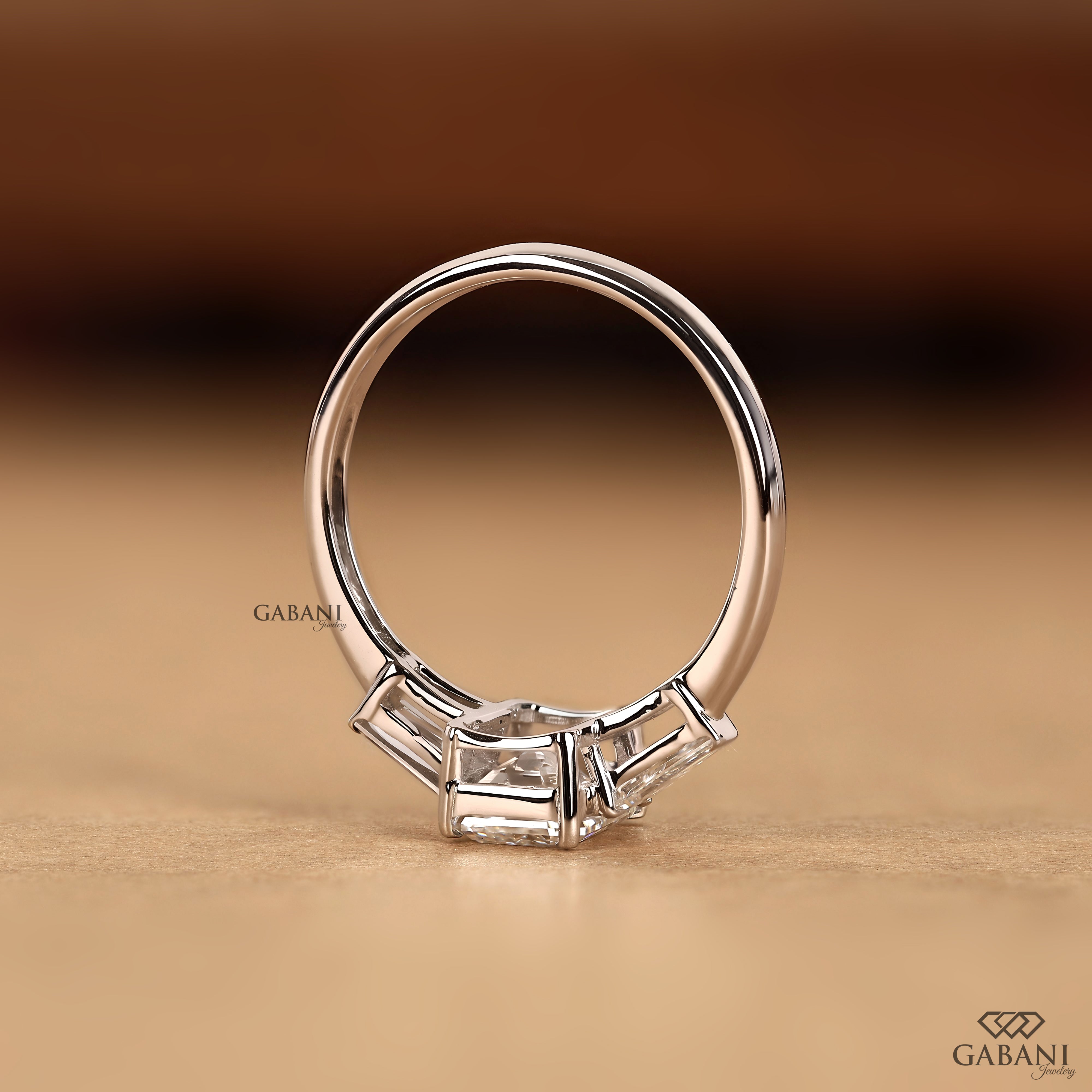 Emerald cut lab grown diamond ring with classic three stone design