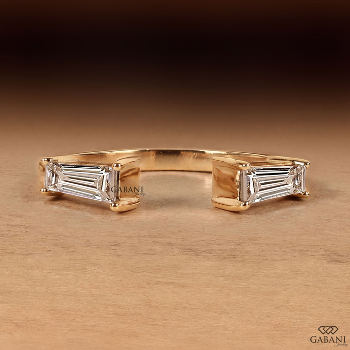 a tapered baguette cut lab grown diamond open cuff ring in 14K yellow gold, featuring two horizontally set diamonds in a modern minimalist design by Gabani Jewelry.