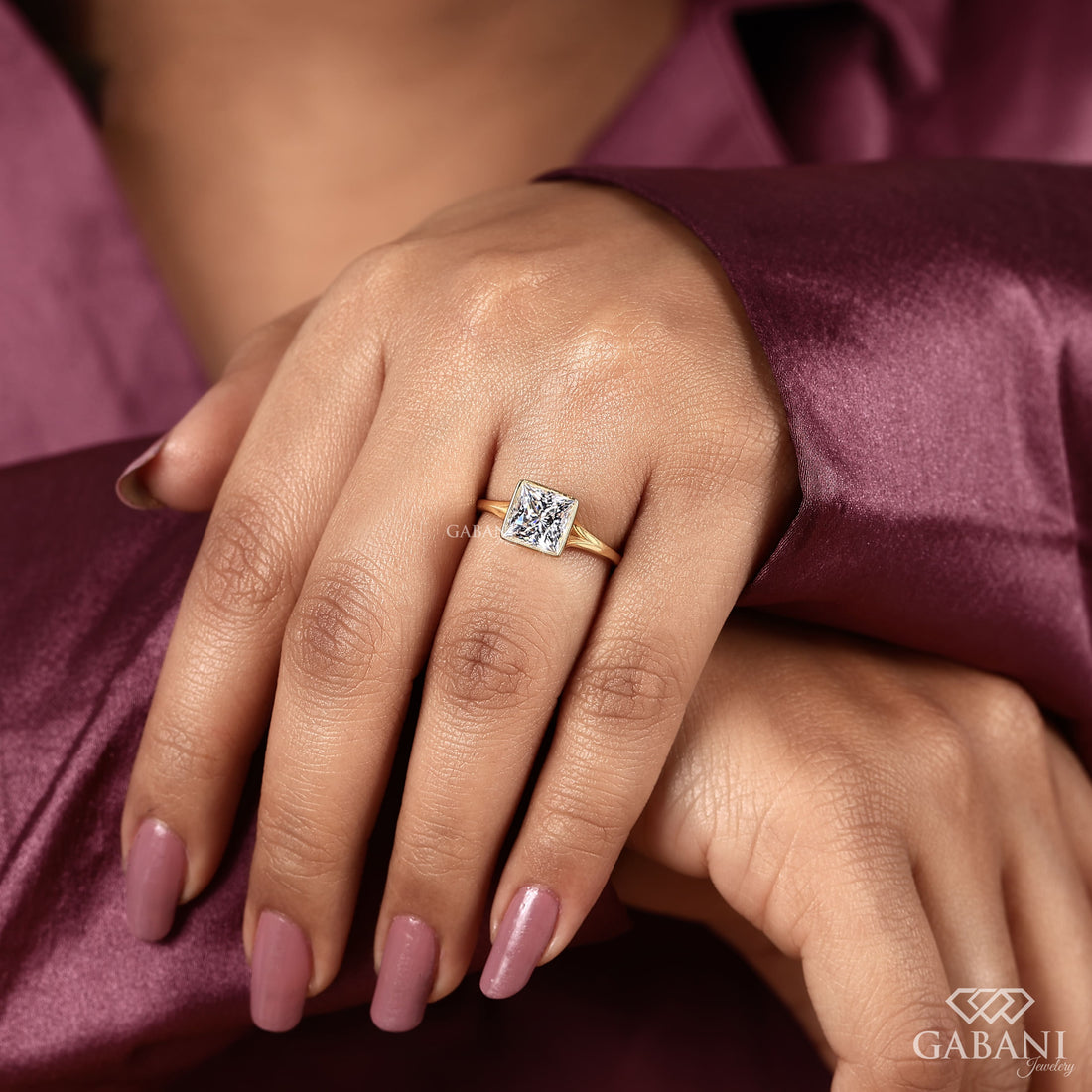 princess cut lab grown diamond engagement ring in 18K yellow gold with a full bezel setting and tapered polished band.