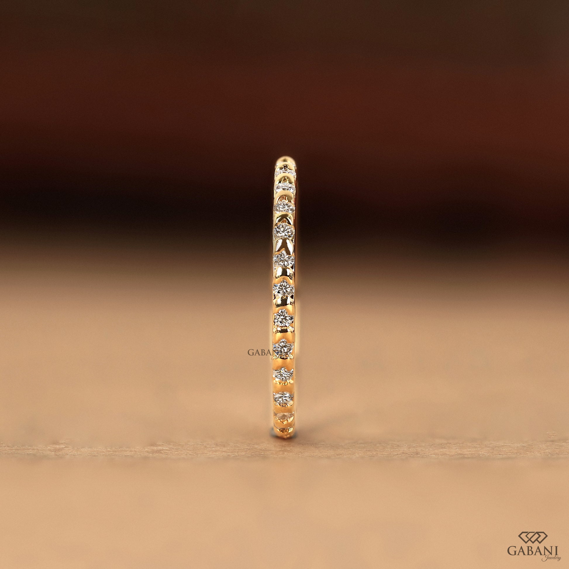 yellow gold eternity ring with round lab diamonds in clean bar setting design