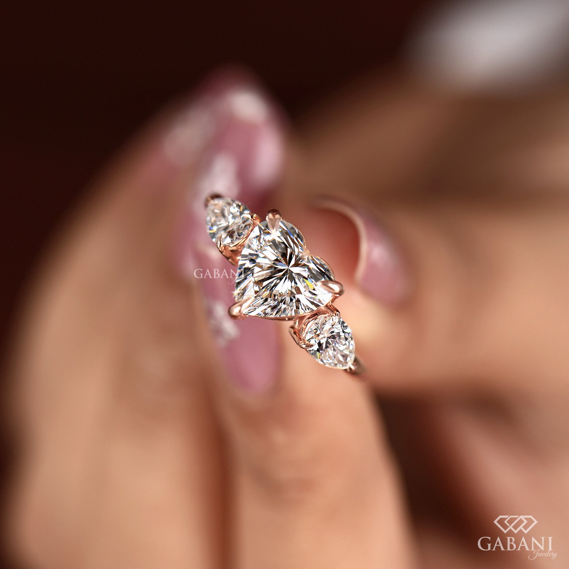 three stone heart cut diamond ring in yellow gold