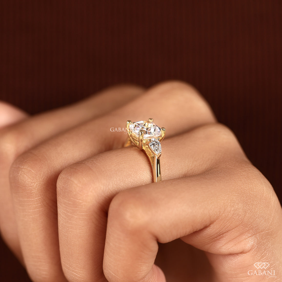 Cushion cut lab grown diamond proposal ring with pear diamonds