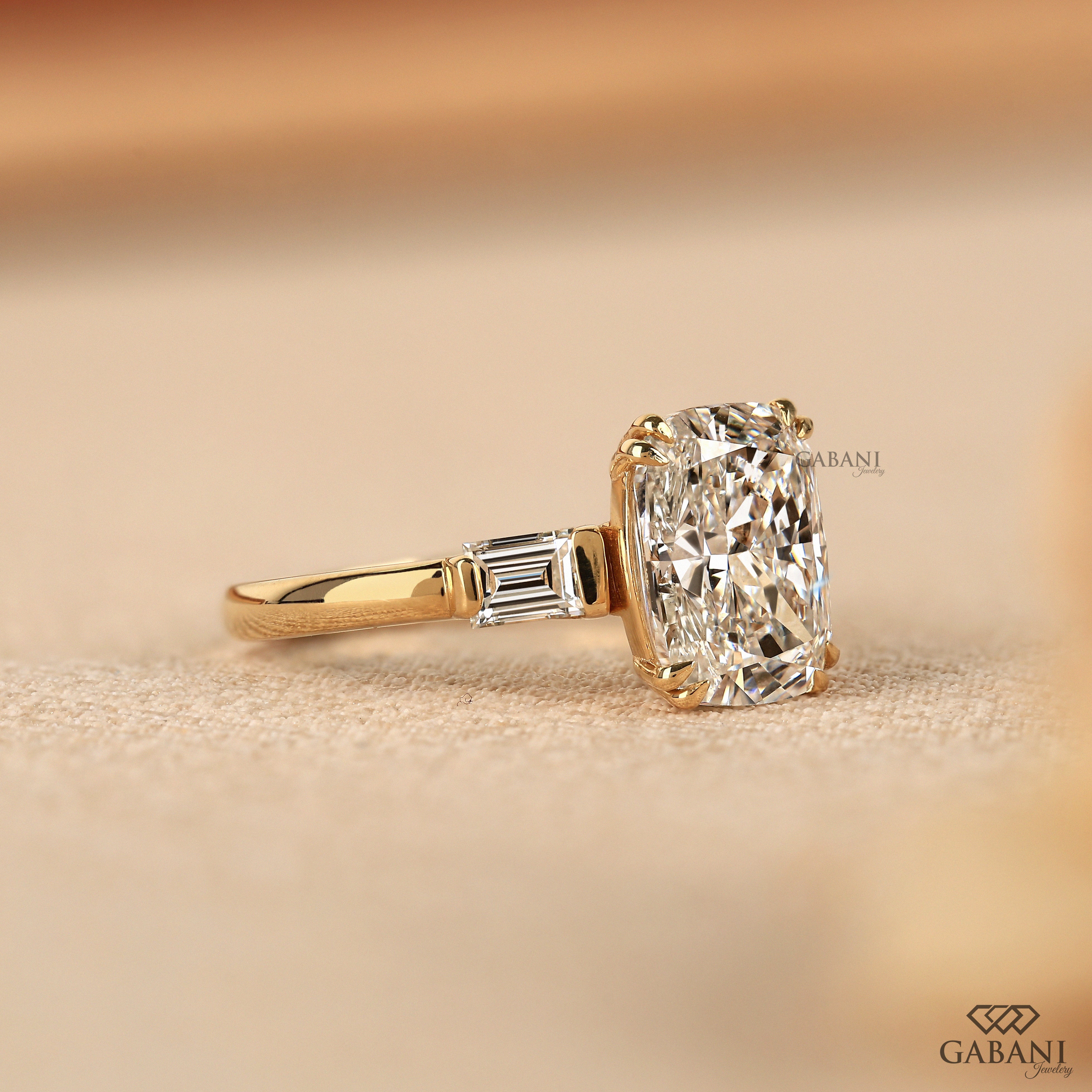 Side view of 14K yellow gold lab grown diamond ring with baguettes