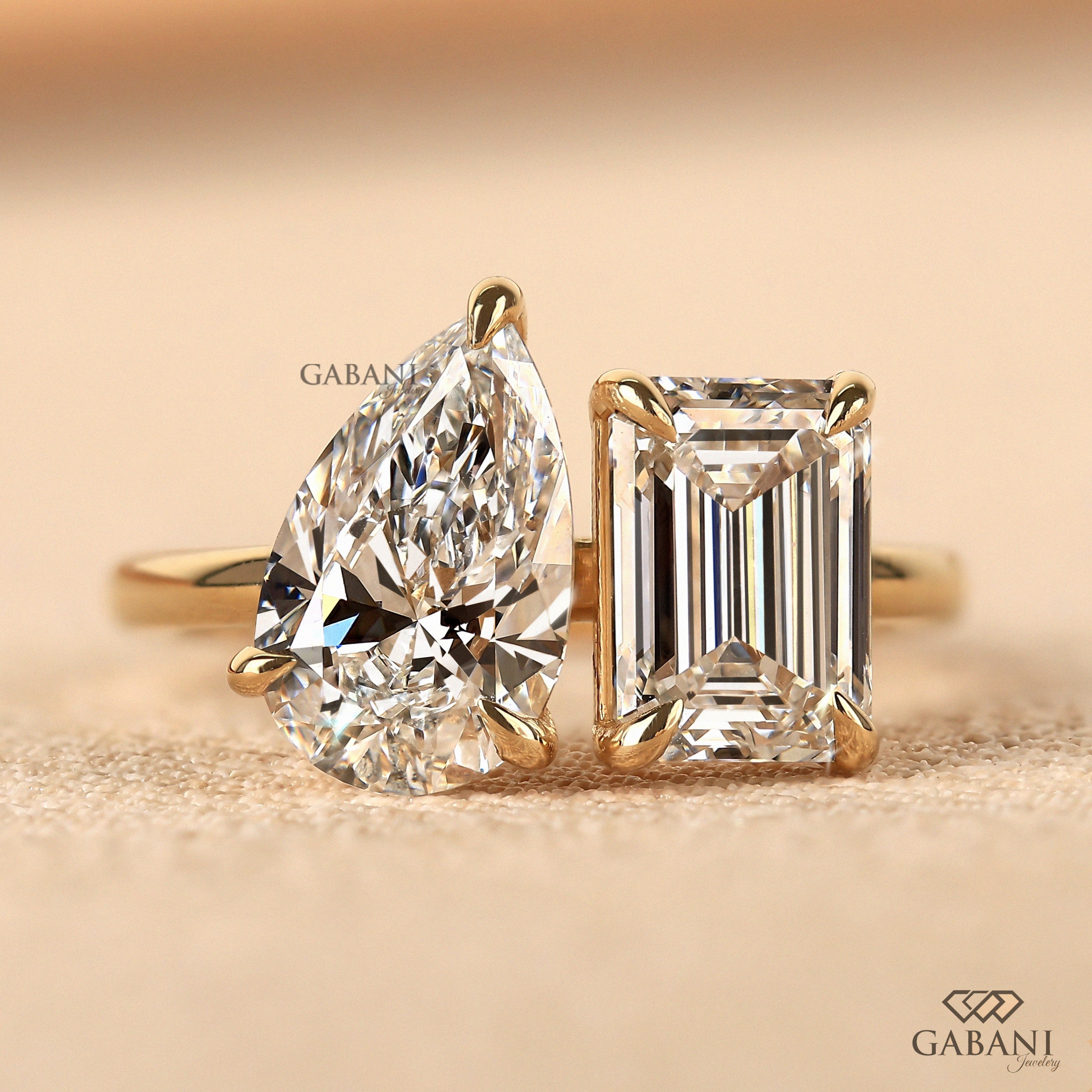 Emerald and pear cut lab grown diamond Toi Et Moi ring