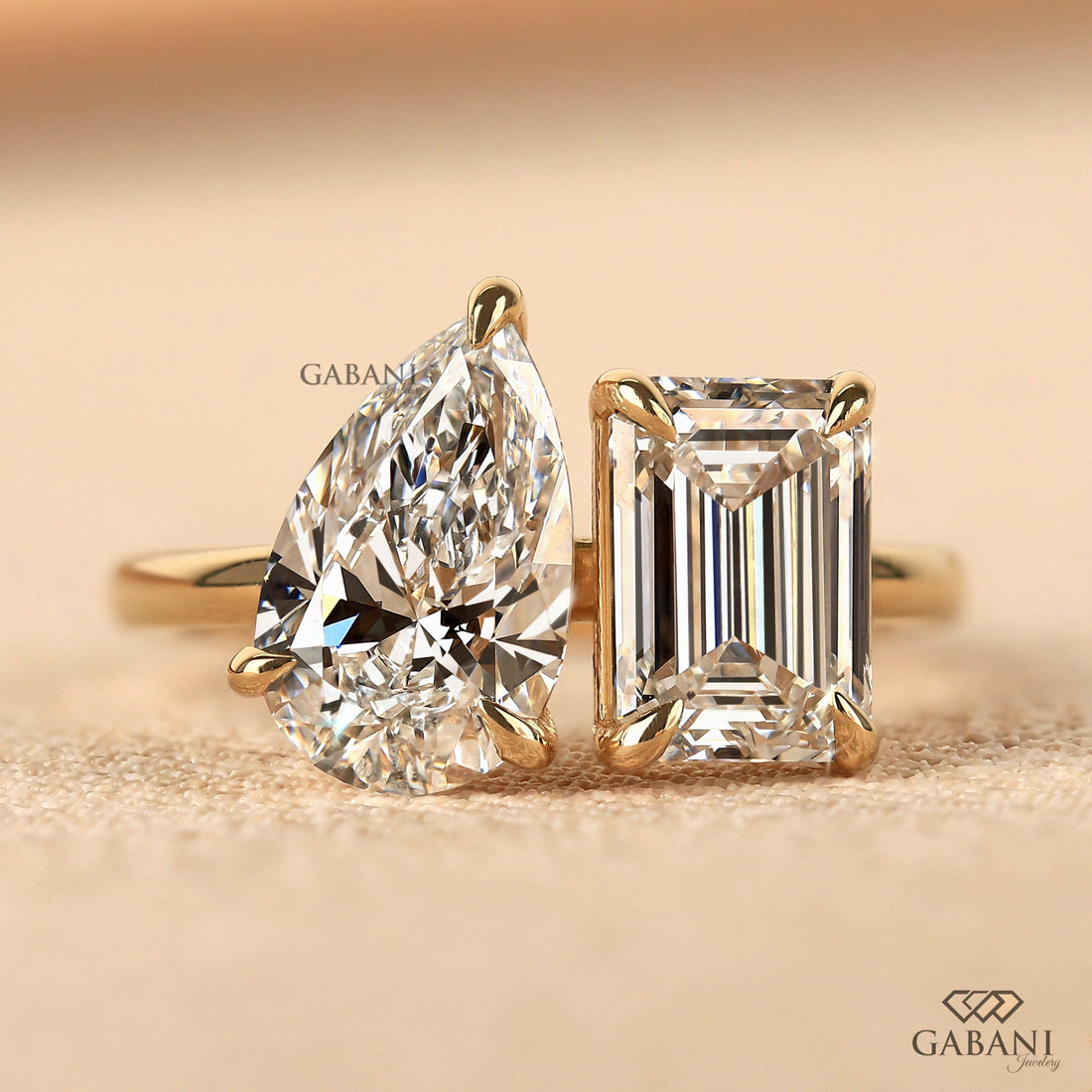 Emerald and pear cut lab grown diamond Toi Et Moi ring