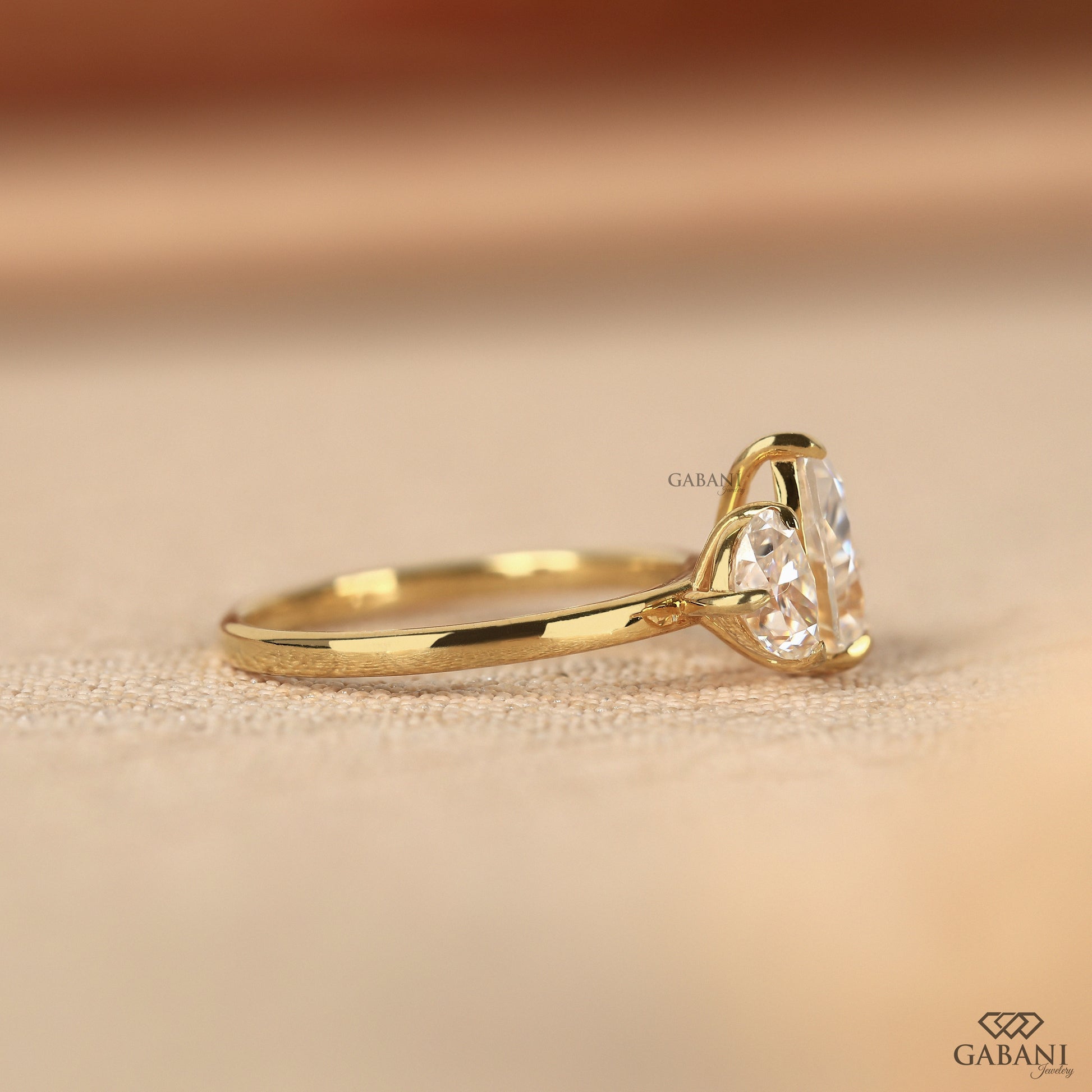 toi et moi ring with pear shaped lab grown diamonds set in yellow gold for a timeless look