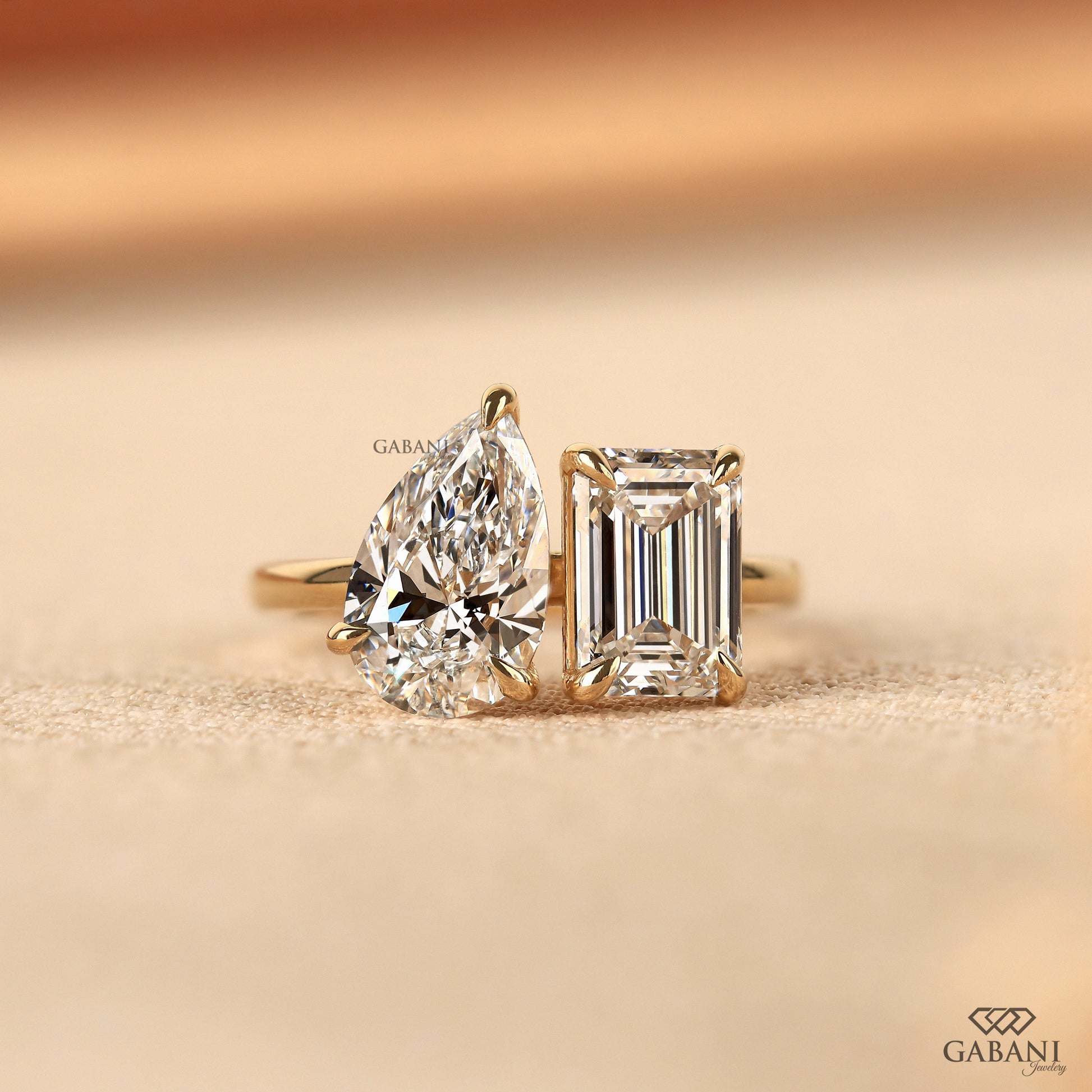 Emerald and pear cut lab grown diamond Toi et Moi ring in 14K solid yellow gold with two stone claw prong design