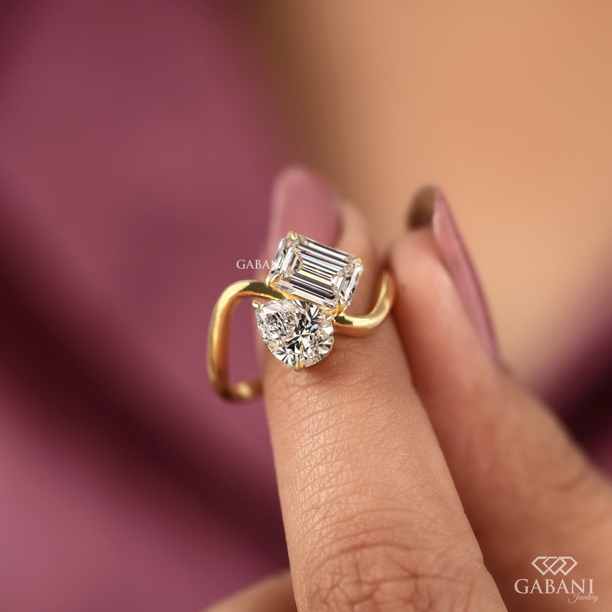 two stone toi et moi ring with emerald cut and pear cut lab grown diamonds in solid yellow gold