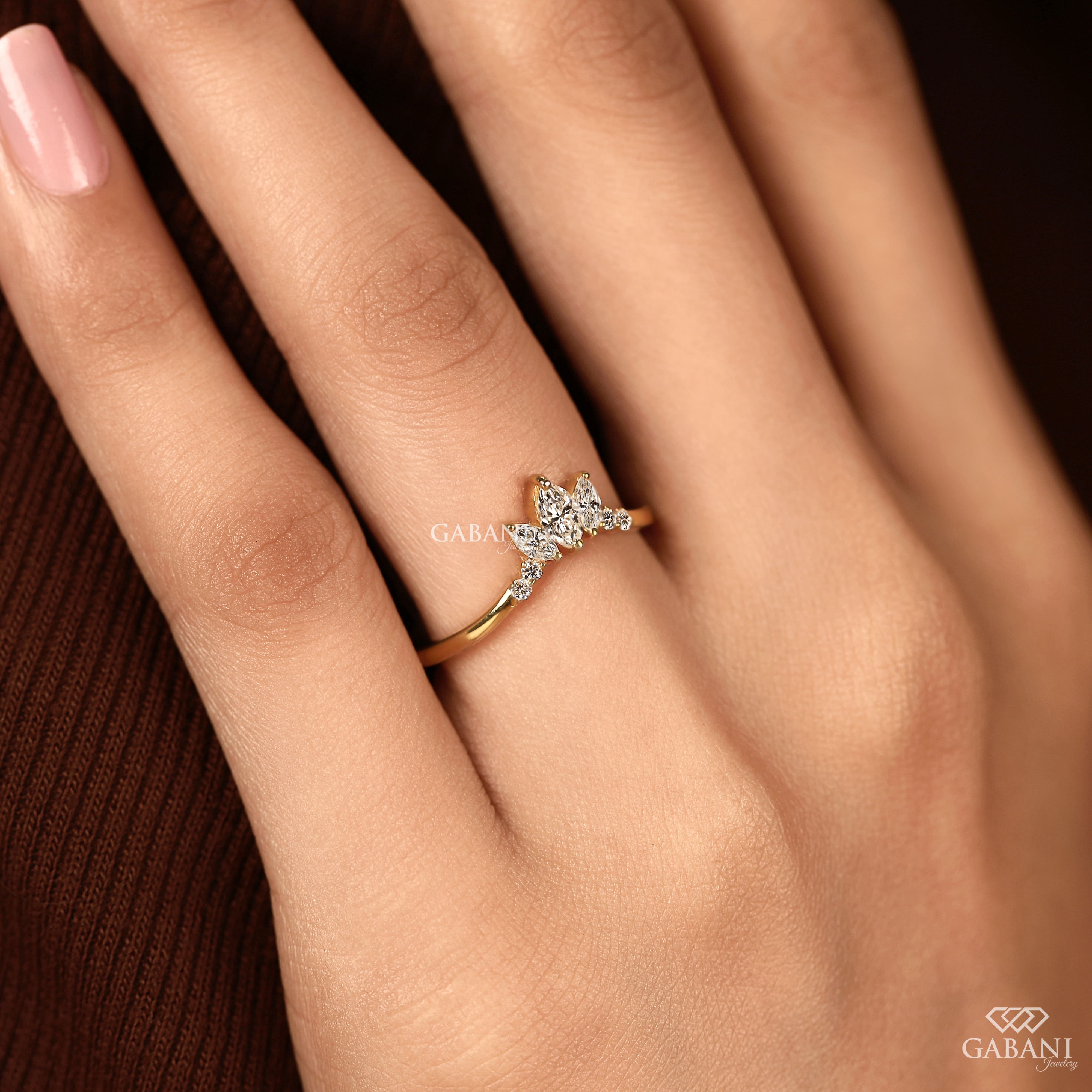 Marquise and round cut lab grown diamond curved wedding band in 14K yellow gold with a contour design, ideal for stacking with an engagement ring.
