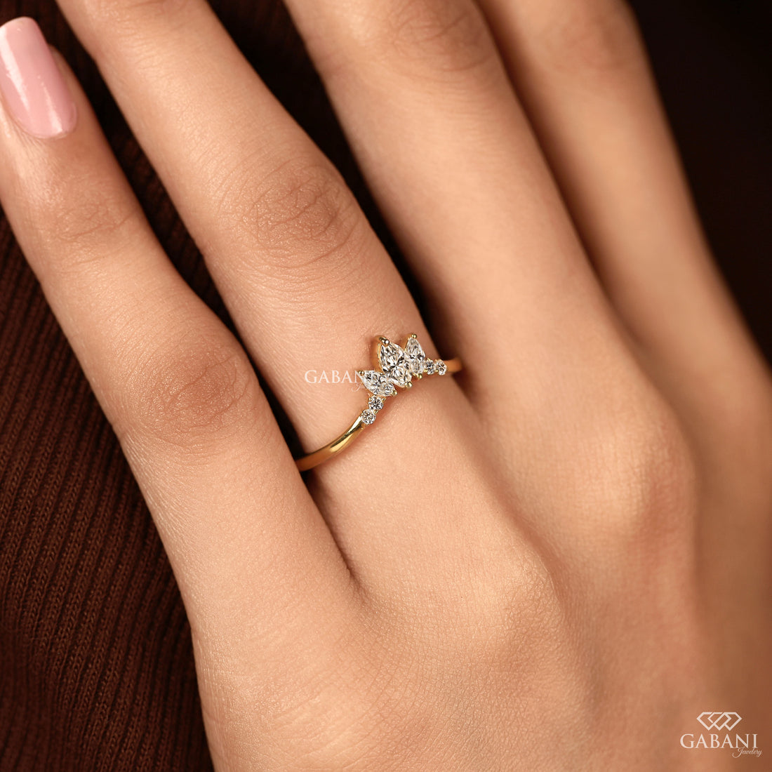 Marquise and round cut lab grown diamond curved wedding band in 14K yellow gold with a contour design, ideal for stacking with an engagement ring.