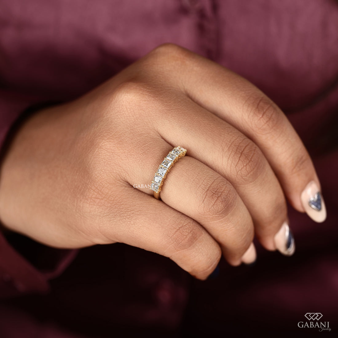 seven stone princess cut lab grown diamond wedding band in 14K yellow gold. A classic half eternity ring for weddings, anniversaries and stacking.