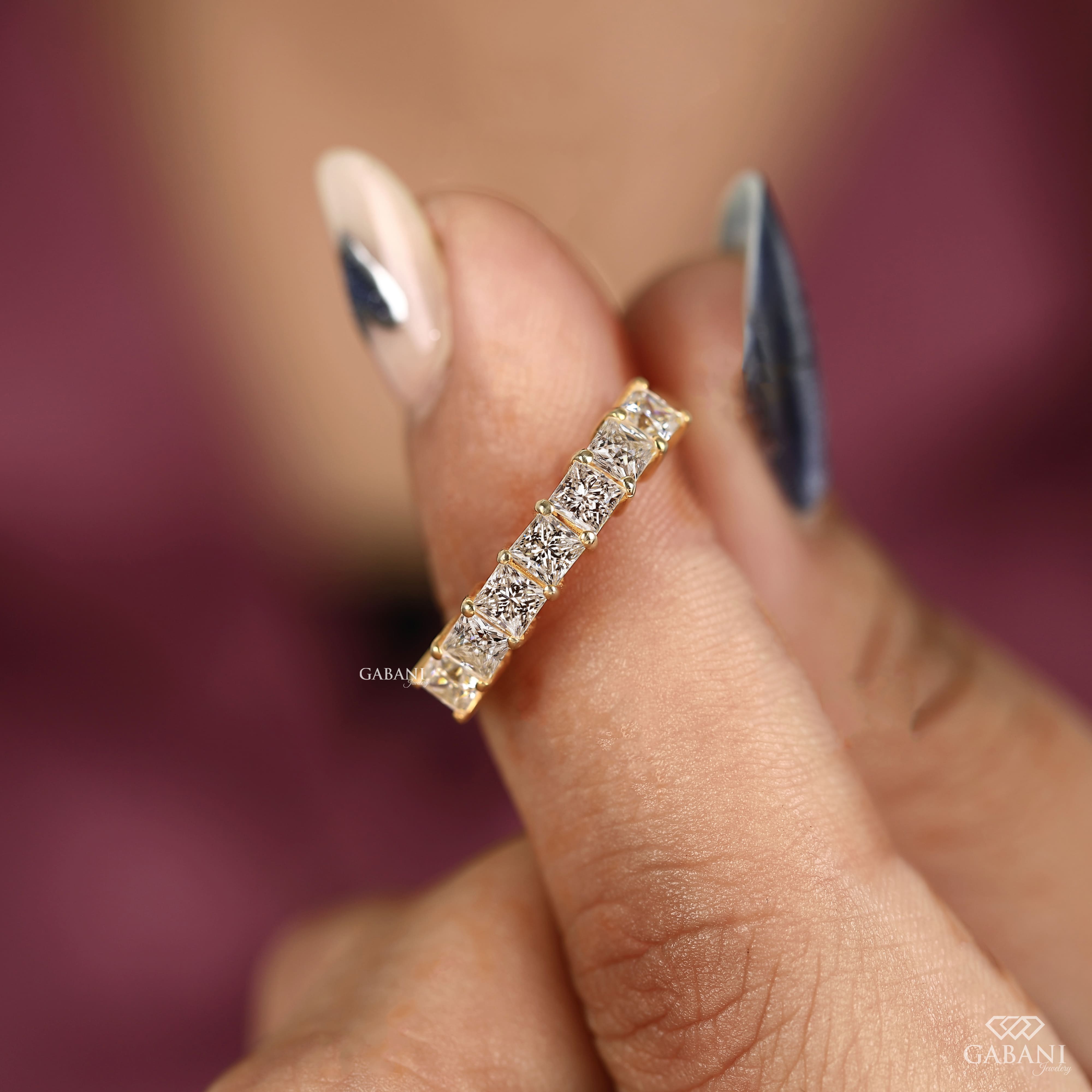 seven stone princess cut lab grown diamond wedding band in 14K yellow gold. A classic half eternity ring for weddings, anniversaries and stacking.