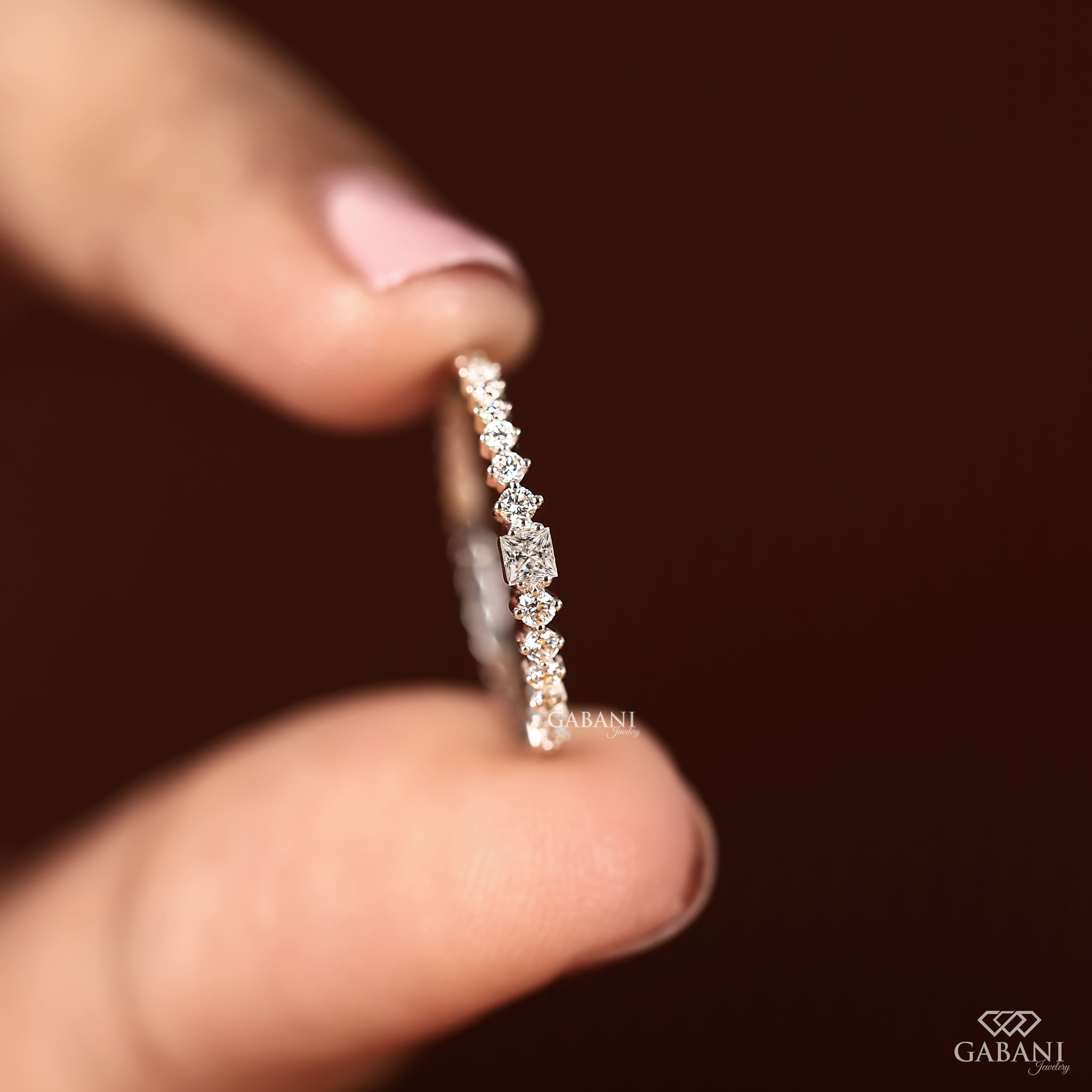 Princess cut and round lab grown diamond wedding band in white gold with graduated prong set diamond design.
