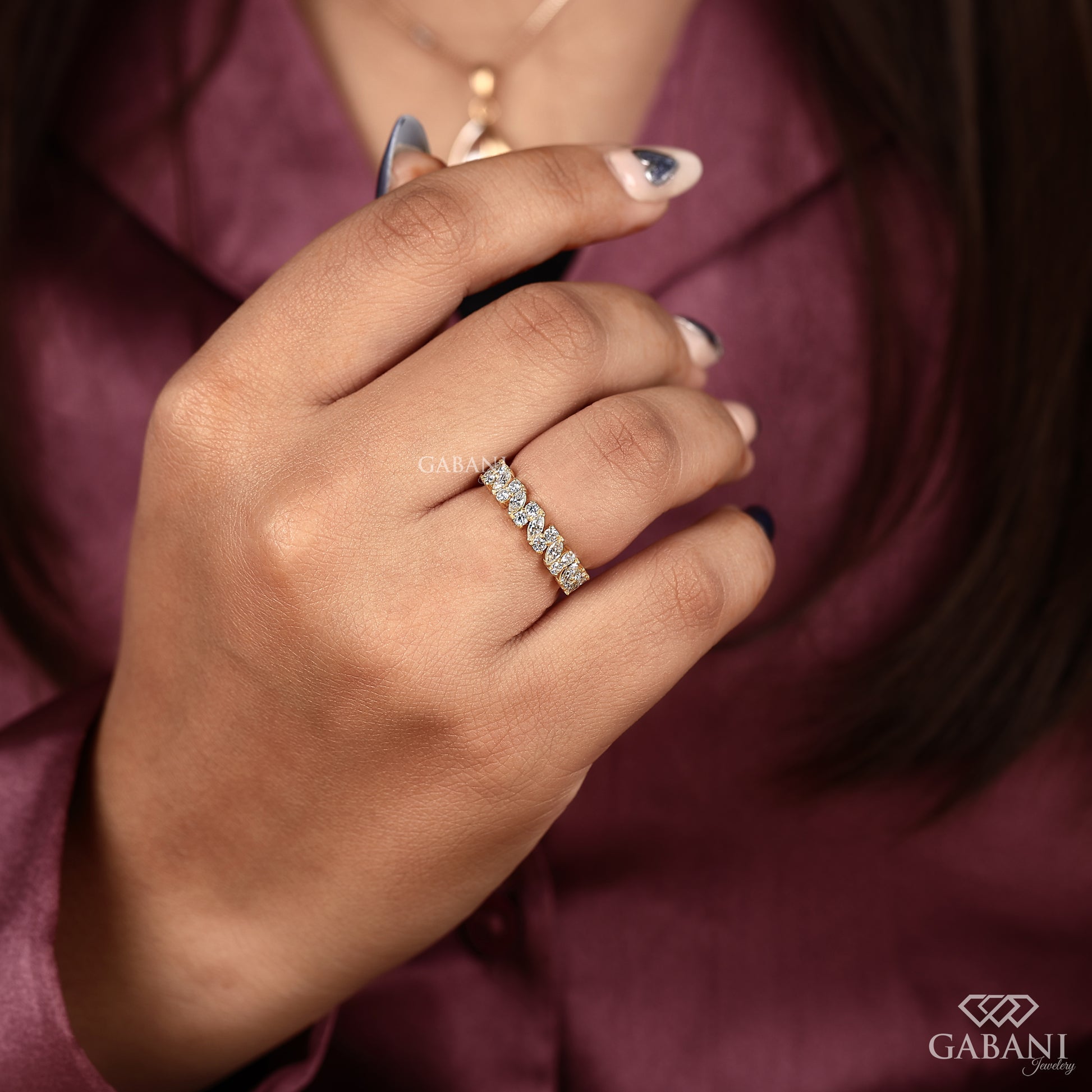 yellow gold wedding band with alternating marquise and round lab grown diamonds in a refined half eternity layout