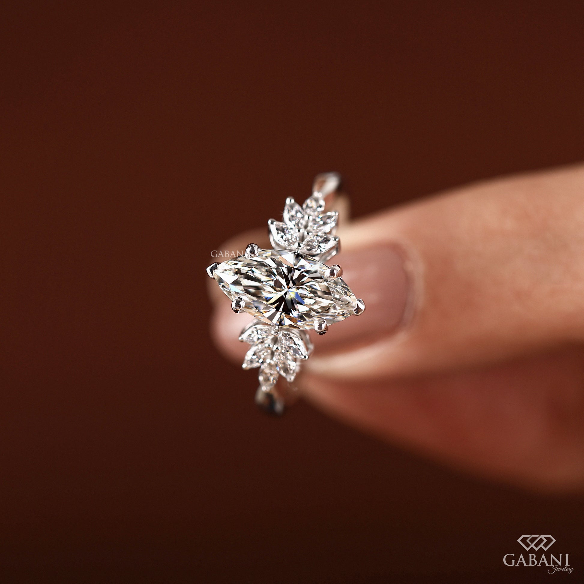 White gold engagement ring featuring marquise cut IGI certified lab grown diamond in secure prong setting