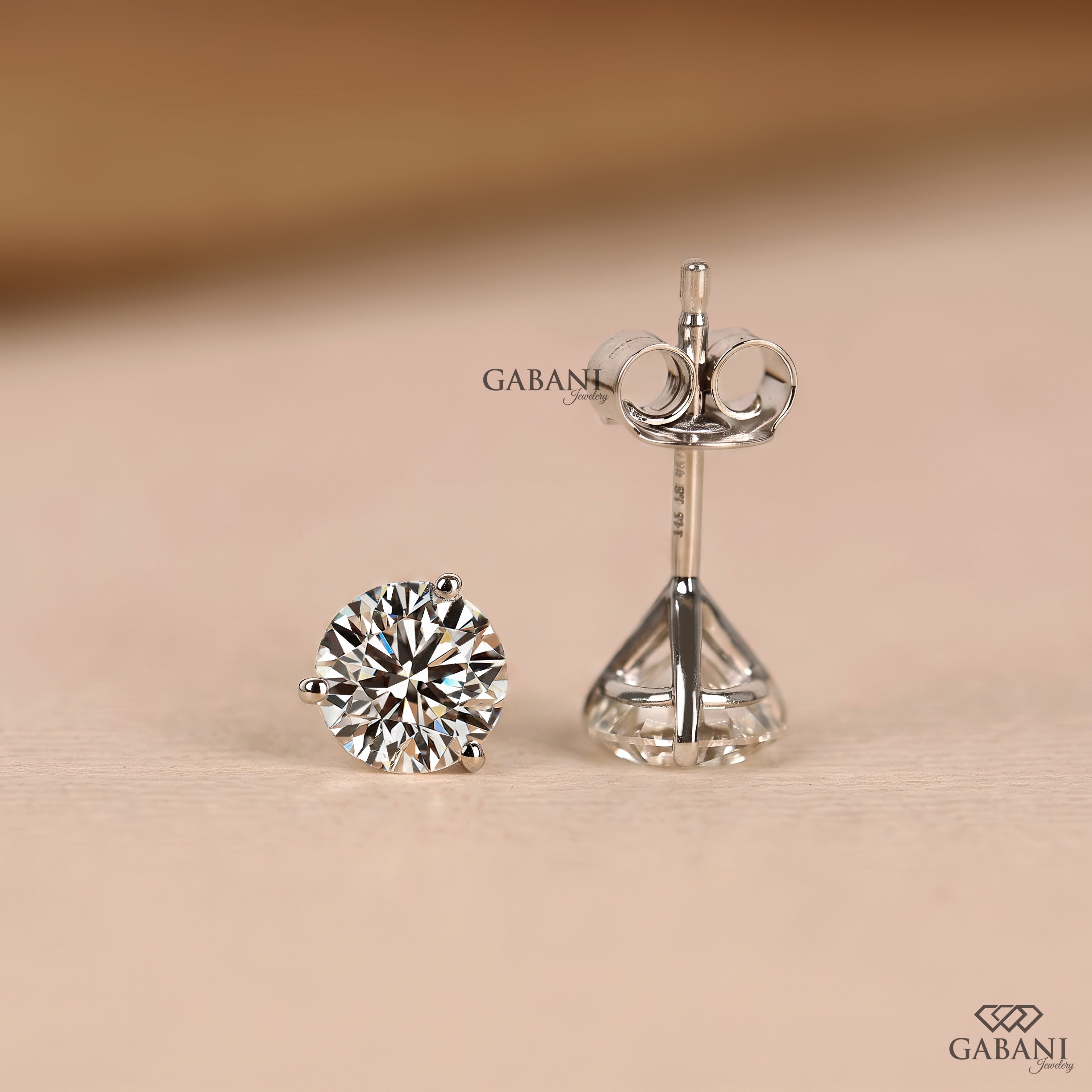 White gold solitaire stud earrings featuring round cut natural diamonds for women