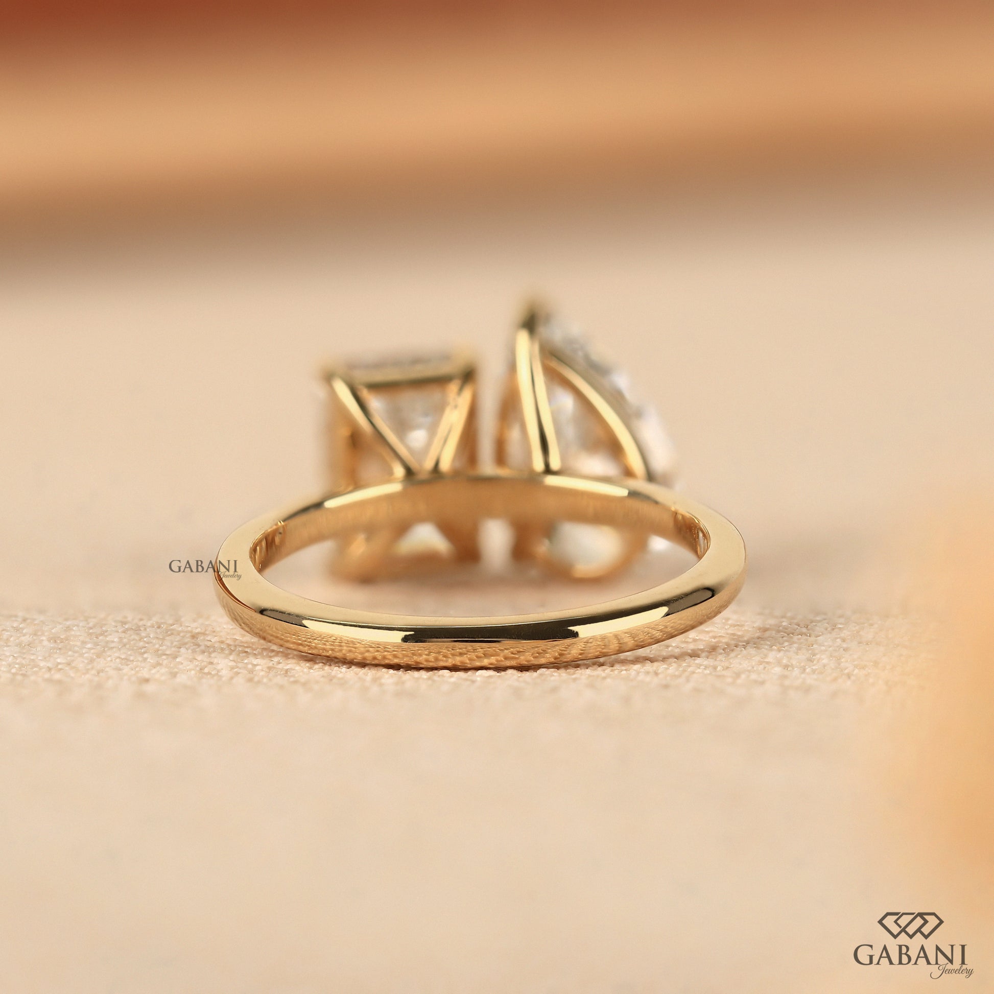 Emerald and pear cut VVS lab diamond ring in 14K yellow gold designed for engagements and milestones