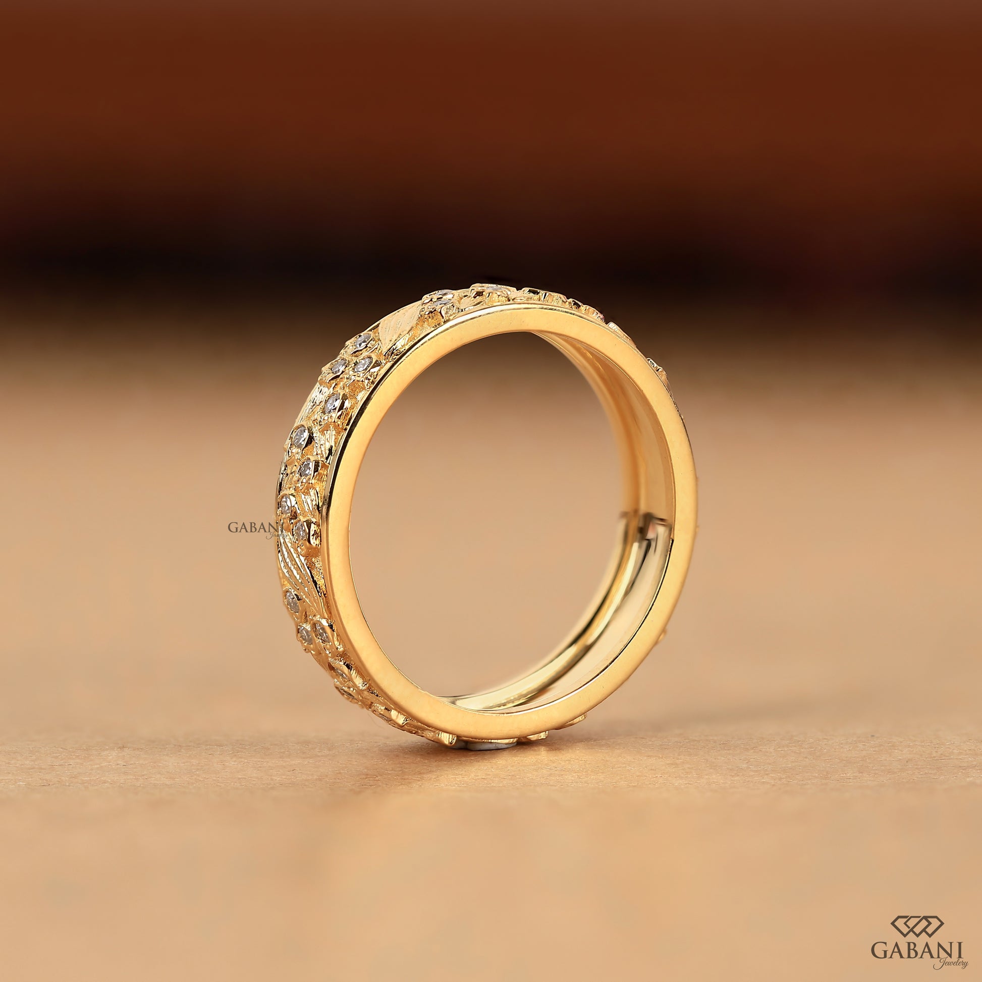 yellow gold nature design wedding band with engraved leaf details