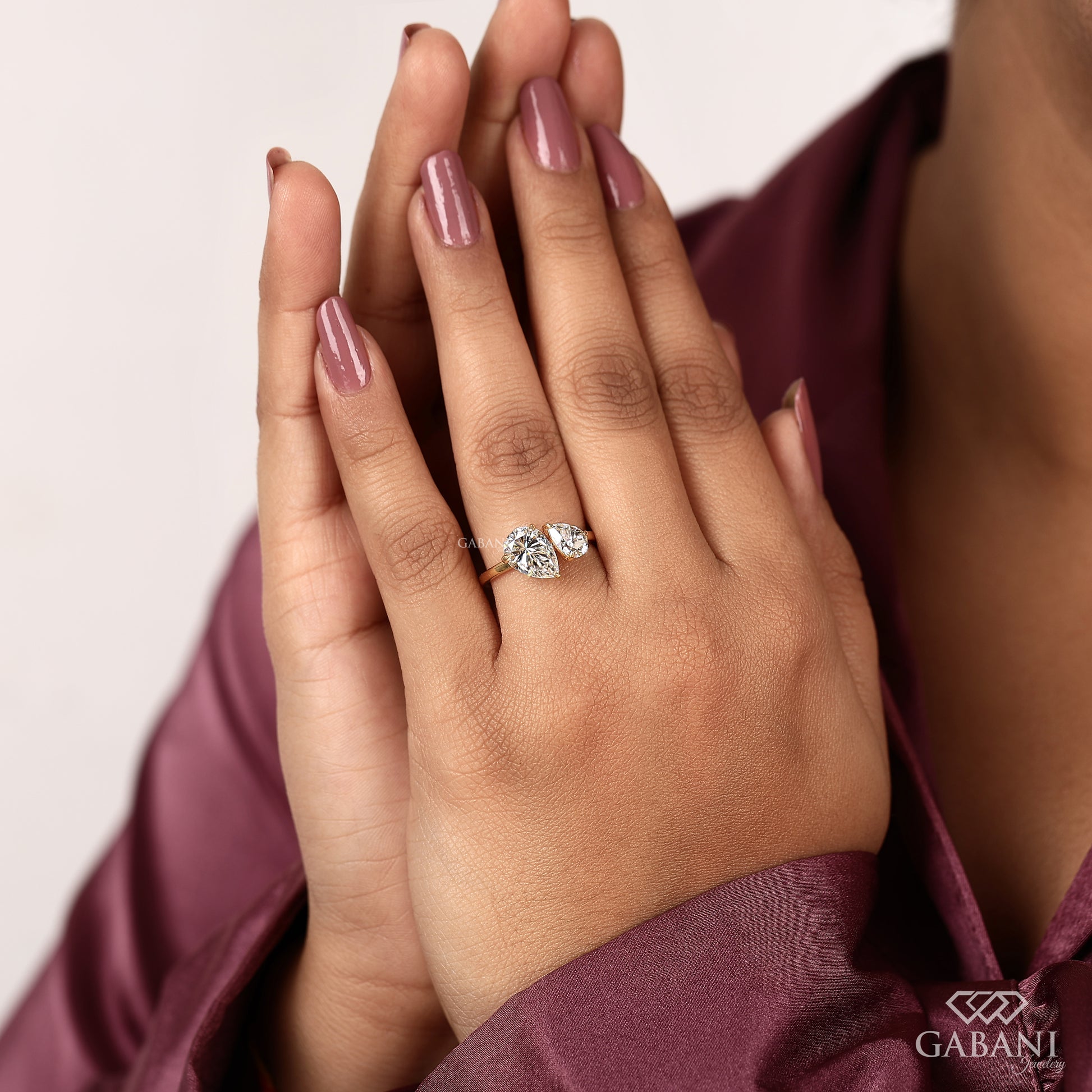 pear shaped lab grown diamond toi et moi ring crafted in solid yellow gold with prong setting